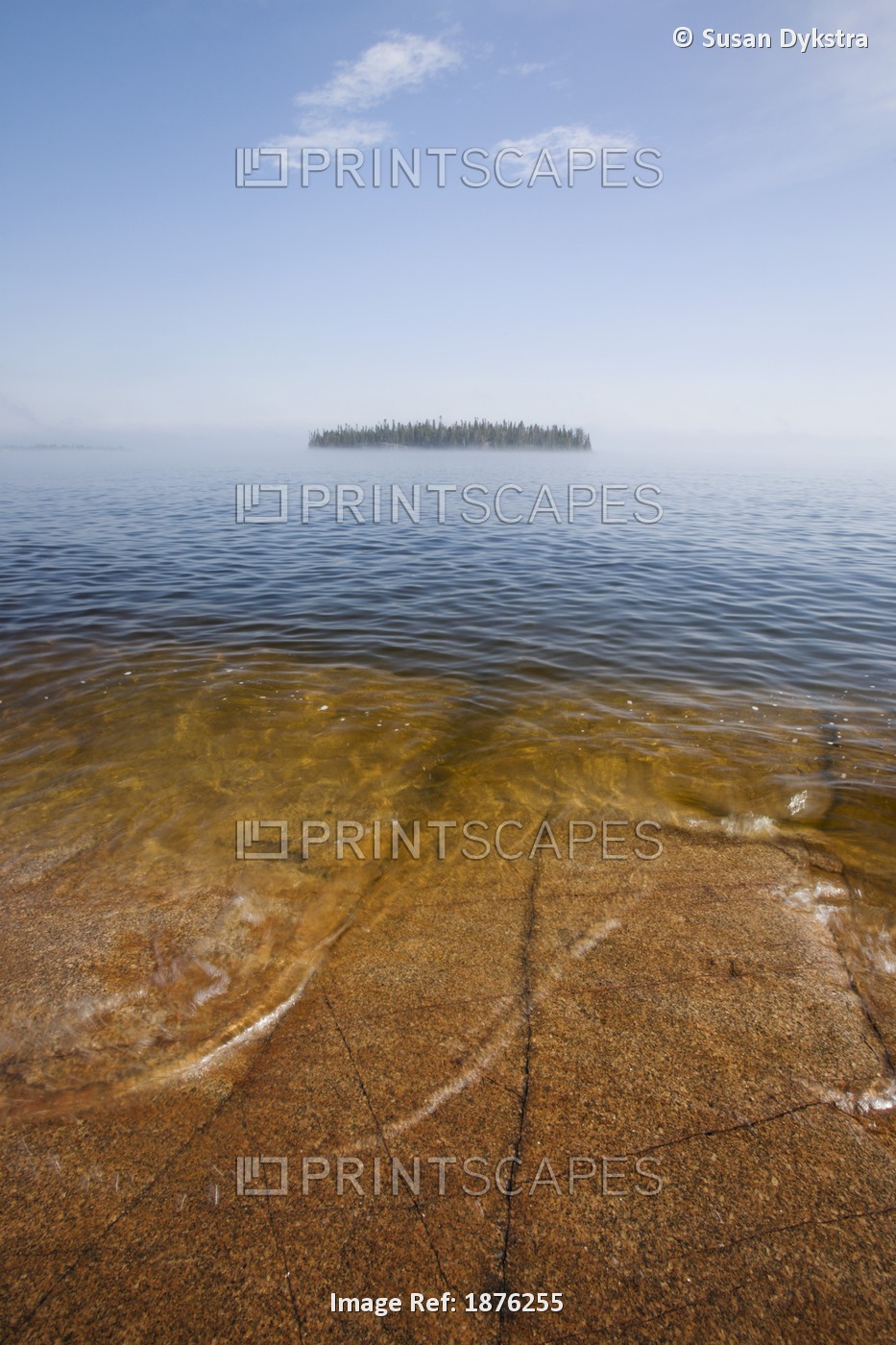 An Island And A Large Rock Slab Under The Water's Surface On Lake Superior