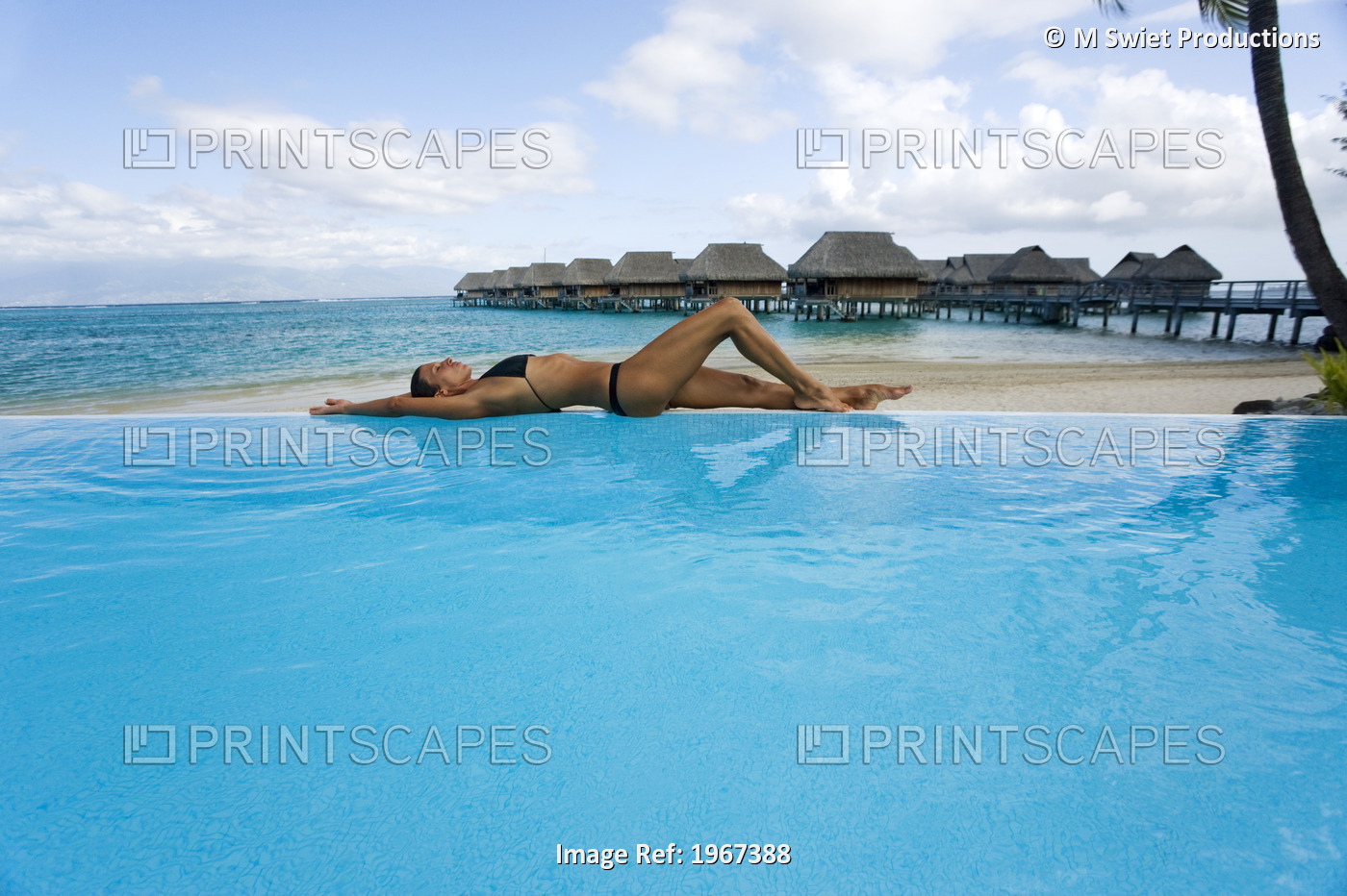 French Polynesia, Moorea, Woman Relaxing At Resort Poolside, Luxury Resort ...