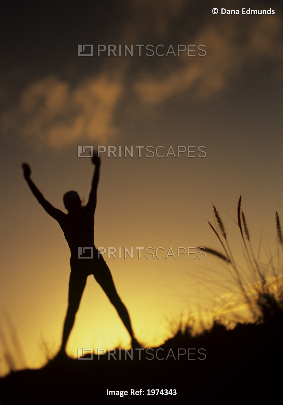 Hawaii, Silhouette Of A Woman Stretching On A Mountain Top At Sunset.