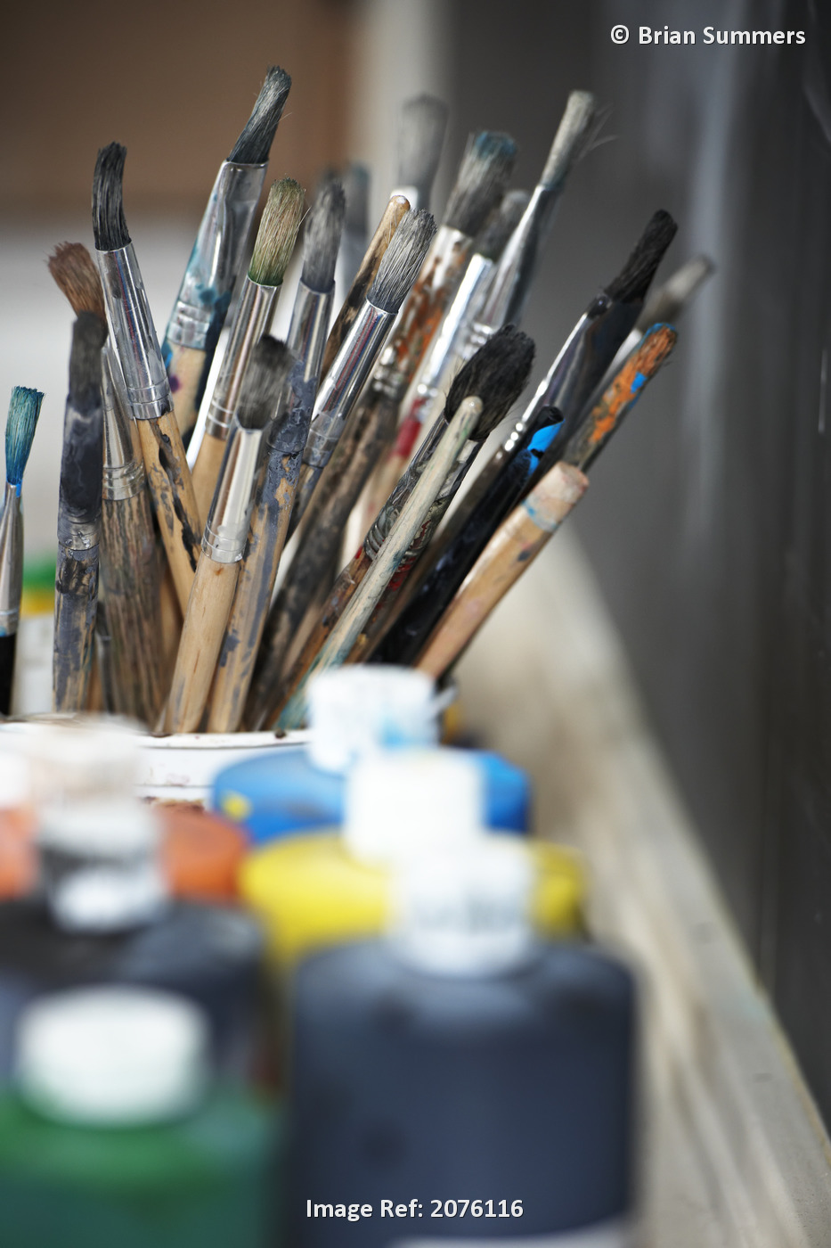 Paint Brushes And Paint Containers In A Classroom