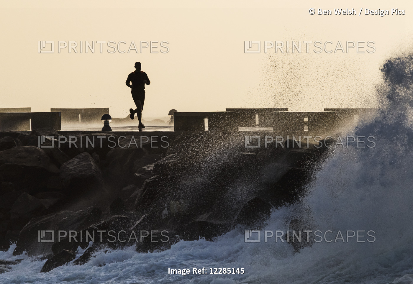 Silhouette Of A Man Running Along The Coast; La Isla, Tarifa, Cadiz, Andalusia, ...